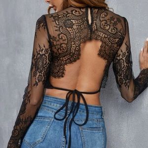 Boho black floral lace sleeve open tie back crop top. Runs a little small..